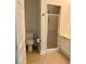This half-bathroom has a neutral paint color, light brown floor tile and a shower at 2575 Rosehill Circle, Lithia Springs, GA 30122