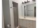Bathroom featuring double sinks with a shower to the side at 2575 Rosehill Circle, Lithia Springs, GA 30122