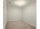 This empty bedroom has neutral paint color and tan carpet at 2575 Rosehill Circle, Lithia Springs, GA 30122