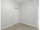 A bedroom with neutral colors and a double-door closet at 2575 Rosehill Circle, Lithia Springs, GA 30122