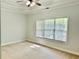 Bedroom with a ceiling fan and a large window providing natural light at 2575 Rosehill Circle, Lithia Springs, GA 30122
