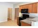 Kitchen featuring a black oven, wood cabinets, and light countertops at 2575 Rosehill Circle, Lithia Springs, GA 30122