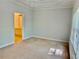 Spacious main bedroom with a light neutral color scheme, large window and ensuite bathroom at 2575 Rosehill Circle, Lithia Springs, GA 30122