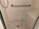This tile shower features a seat, handrail and mosaic tile floor at 2575 Rosehill Circle, Lithia Springs, GA 30122