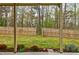 View of fenced backyard and lawn area at 8045 Hillside Climb Way, Snellville, GA 30039