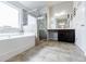 Beautiful bathroom featuring tub, tiled shower and lots of counter space at 8045 Hillside Climb Way, Snellville, GA 30039