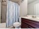 Bathroom featuring a tub/shower combination, toilet, and single vanity at 8045 Hillside Climb Way, Snellville, GA 30039