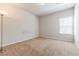 Spacious carpeted bedroom with neutral walls and natural light at 8045 Hillside Climb Way, Snellville, GA 30039