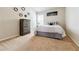Neutral bedroom featuring a large bed, carpet and neutral colors at 8045 Hillside Climb Way, Snellville, GA 30039