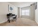 Cozy bedroom with neutral carpet, bright window and a black computer desk at 8045 Hillside Climb Way, Snellville, GA 30039