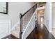 Grand foyer with hardwood floors, elegant staircase and decorative wainscoting at 8045 Hillside Climb Way, Snellville, GA 30039