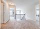 Second floor hallway featuring neutral carpet and paint colors with several entryways at 8045 Hillside Climb Way, Snellville, GA 30039