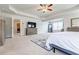 Spacious main bedroom with neutral carpet and ample natural light at 8045 Hillside Climb Way, Snellville, GA 30039