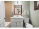 Bathroom featuring a vanity, toilet, and shower with neutral color tiles and modern lighting at 1384 Windburn Dr, Marietta, GA 30066