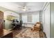 Bright bedroom featuring built-in shelves, a ceiling fan, and unique surfboards as decorations at 1384 Windburn Dr, Marietta, GA 30066