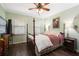 A well-lit bedroom with wood floors, a ceiling fan, and classic decor at 1384 Windburn Dr, Marietta, GA 30066