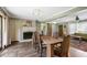 Combined dining and living area features dark wood floors, fireplace and neutral wall color at 1384 Windburn Dr, Marietta, GA 30066