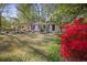 Charming single-story home with white brick and colorful shrubbery at 1384 Windburn Dr, Marietta, GA 30066