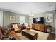 Comfortable living room featuring leather furniture and a decorative chandelier at 1384 Windburn Dr, Marietta, GA 30066
