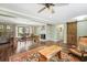 Open concept living and dining areas featuring light green walls, fireplace, and access to exterior at 1384 Windburn Dr, Marietta, GA 30066