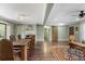 Open concept living and dining areas featuring light green walls, fireplace, and access to exterior at 1384 Windburn Dr, Marietta, GA 30066