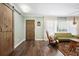 Inviting living room featuring hardwood floors, light green walls, and barn-door access at 1384 Windburn Dr, Marietta, GA 30066