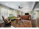 A spacious living room with neutral walls, dark wood floors, and a ceiling fan at 1384 Windburn Dr, Marietta, GA 30066