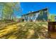 Spacious backyard featuring a well-maintained lawn and an exterior storage shed at 166 Rustin Dr, Dallas, GA 30157