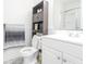 Bathroom with storage cabinet, shower with glass door and white countertop sink at 166 Rustin Dr, Dallas, GA 30157