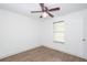 Bright, airy bedroom with hardwood floors, a ceiling fan, and natural light from the window at 166 Rustin Dr, Dallas, GA 30157