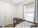Spare bedroom featuring a window, wood floors, and plenty of room for a single bed at 166 Rustin Dr, Dallas, GA 30157