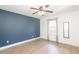 Spacious bedroom features a ceiling fan, window and hardwood floors at 166 Rustin Dr, Dallas, GA 30157