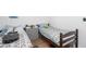 Shared bedroom featuring twin beds, wood floors, and ample space for relaxation at 166 Rustin Dr, Dallas, GA 30157
