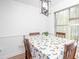 Charming dining area bathed in natural light, featuring a table set for a cozy meal, complemented by a peaceful view at 166 Rustin Dr, Dallas, GA 30157