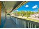 View from the porch, showcasing the home's exterior features and serene neighborhood setting with mature trees at 166 Rustin Dr, Dallas, GA 30157