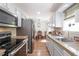 Well-appointed kitchen featuring granite counters, a modern refrigerator, and eat-in dining area at 166 Rustin Dr, Dallas, GA 30157