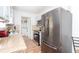 Updated kitchen with stainless steel appliances, granite counters, and ample cabinet space at 166 Rustin Dr, Dallas, GA 30157