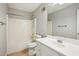 Bathroom view featuring tub with shower, toilet, vanity with sink, and large mirror on the wall at 1900 Foster Trace Ct, Lawrenceville, GA 30043