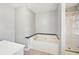 A bathroom showcasing a large soaking tub next to a glass door shower at 1900 Foster Trace Ct, Lawrenceville, GA 30043