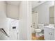 Bathroom and stairs combination with access to living room with fireplace at 1900 Foster Trace Ct, Lawrenceville, GA 30043