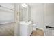 Bathroom featuring a white vanity with a large framed mirror and a toilet at 1900 Foster Trace Ct, Lawrenceville, GA 30043