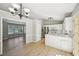 Bright kitchen with stainless appliances and an open view to the living room at 1900 Foster Trace Ct, Lawrenceville, GA 30043