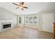 Spacious living room features a fireplace, natural light and neutral paint at 1900 Foster Trace Ct, Lawrenceville, GA 30043