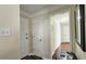 Entryway with neutral paint, dark hardwood floors, white doors, and white trim and access to closets at 311 Peachtree Hills Ne Ave # 17C, Atlanta, GA 30305