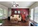 Living room with neutral walls, dark wood floors, white trim, and large windows with bright natural light at 311 Peachtree Hills Ne Ave # 17C, Atlanta, GA 30305