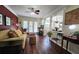 Spacious living room with hardwood floors, neutral paint, view to the dining room, and bright natural light at 311 Peachtree Hills Ne Ave # 17C, Atlanta, GA 30305