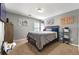 Bedroom featuring carpeted floors, gray walls and a dark wood bed frame at 3889 Elm Trace Dr, Loganville, GA 30052