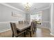 Formal dining room with stylish decor, neutral paint, and a large window at 3889 Elm Trace Dr, Loganville, GA 30052