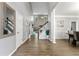 Bright foyer with hardwood floors, staircase, and high ceilings at 3889 Elm Trace Dr, Loganville, GA 30052