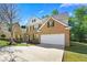 Beautiful two-story brick home featuring a driveway and well-maintained landscaping at 3889 Elm Trace Dr, Loganville, GA 30052